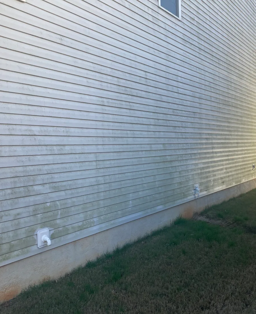 House siding before pressure washing